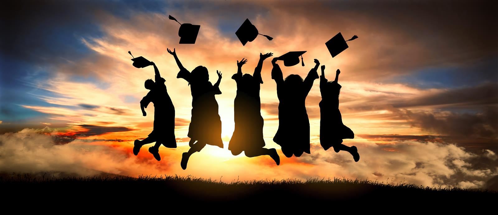 Students who graduated jumping in the air
