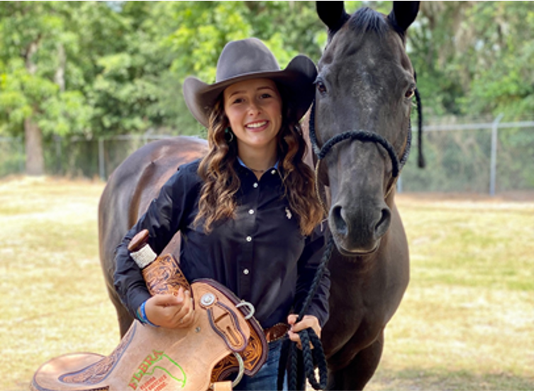 Sara Hendrix next to her horse